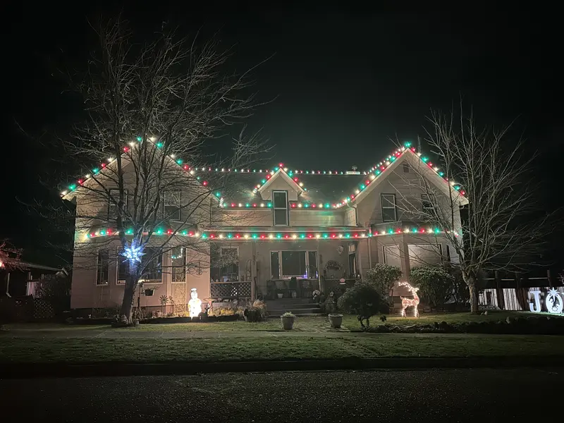 A Port Angeles home fully lit for the holidays, installed by Brisk Pressure Washing